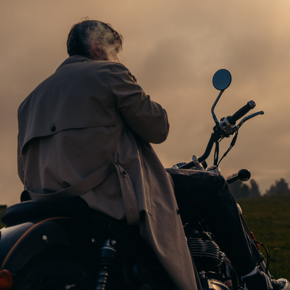 camera, pair of brown shoes, white ceramic mug, grey and black pen, brown smoking pipe